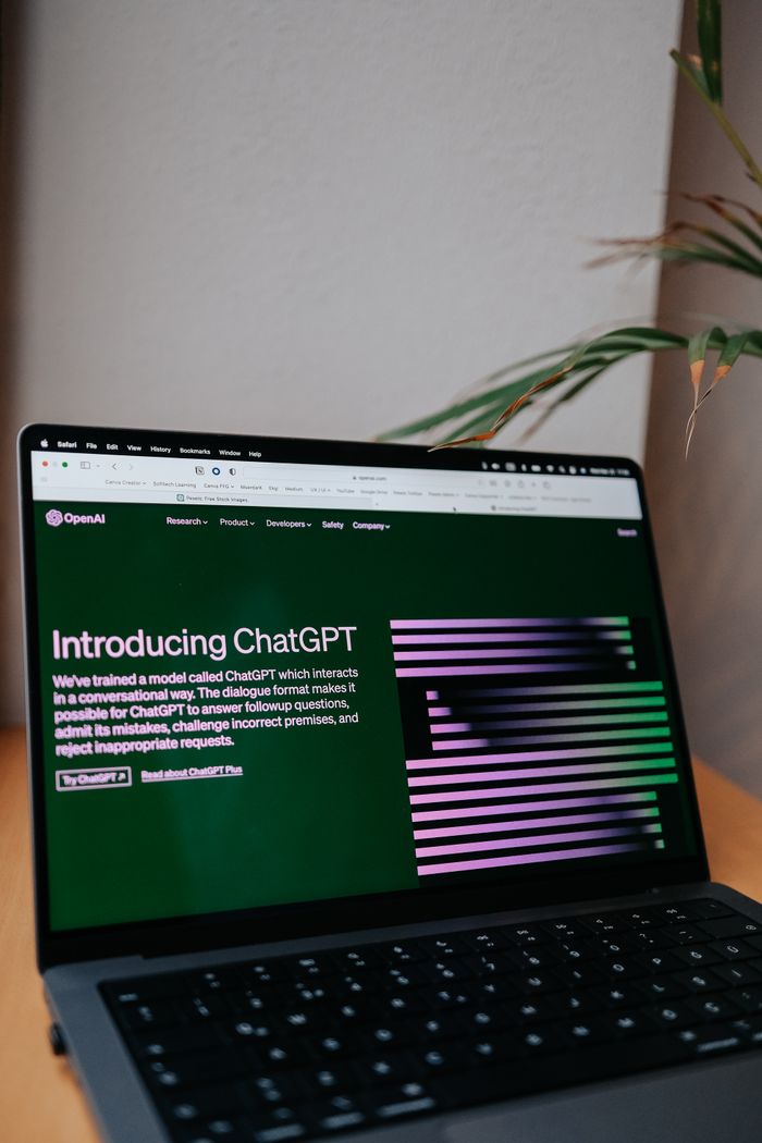 about-us-01 OpenAI ChatGPT introduction on a laptop screen with focus on new AI features.